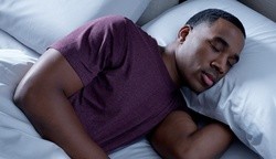 A man sleeping on a Breeze mattress