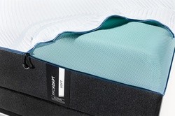 a top cover unzipped , folded over the corner of a ProAdapt Soft mattress