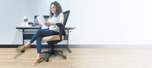A woman working in an office chair