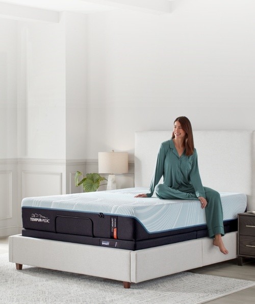 Woman sitting on ProAdapt mattress