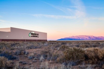 TempurPedic Albuquerque Plant picutred in front of a dessert mountain range