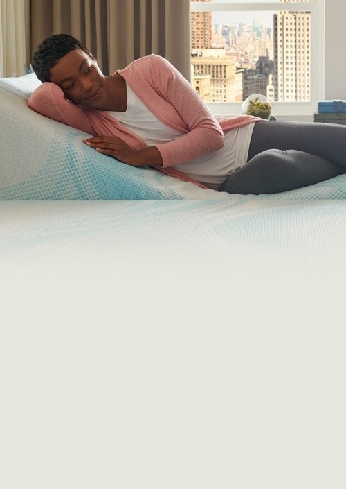 Woman sleeping on her split-king Tempur mattress