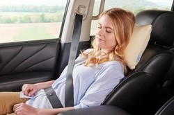 Woman using ComfortPillow - Travel model in the car