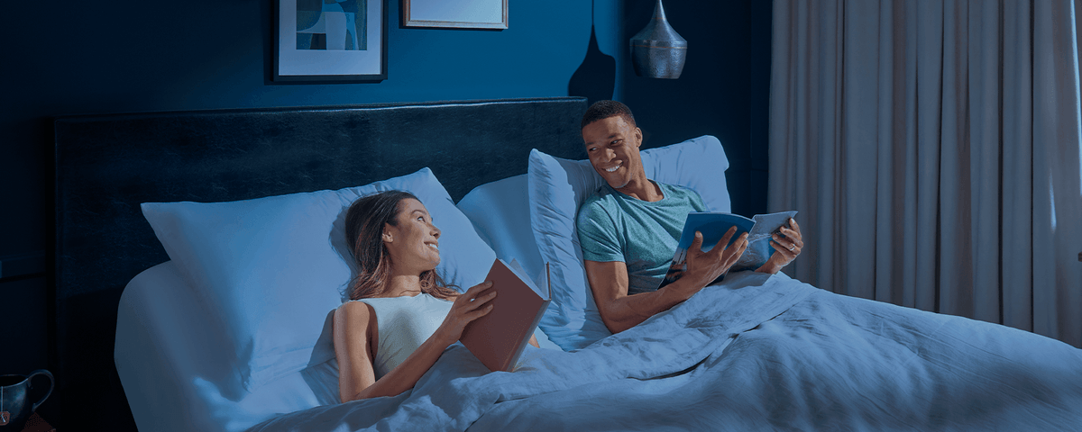 Couple Laying on Mattress with Head Raised