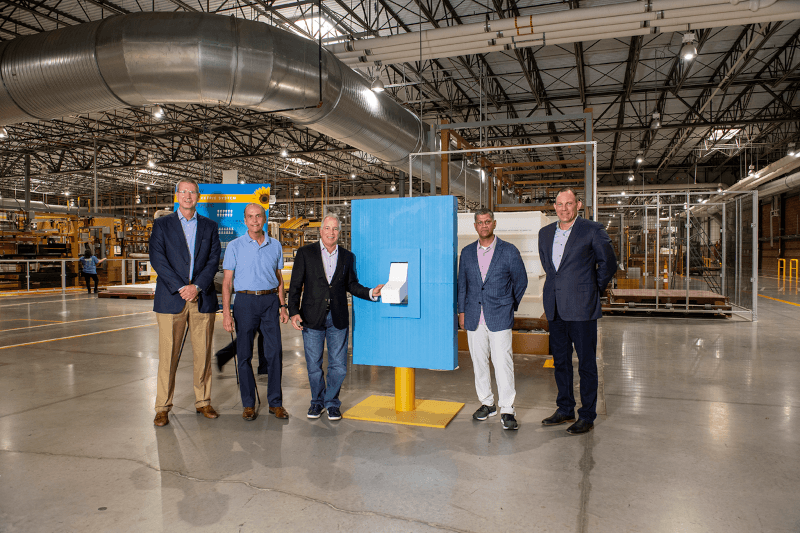 CEO Scott Thompson and other executives posing in the Tempur-Sealy manufacturing plant in Albuqueque New Mexico