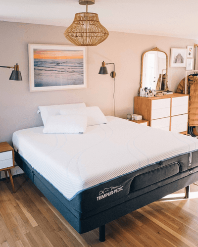 photo of mattress without any bedding in styled room