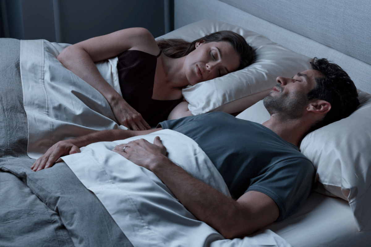 couple sleeping in bed at night