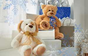 A Tempur teddy bear and stuffed puppy dog toy with gifts.